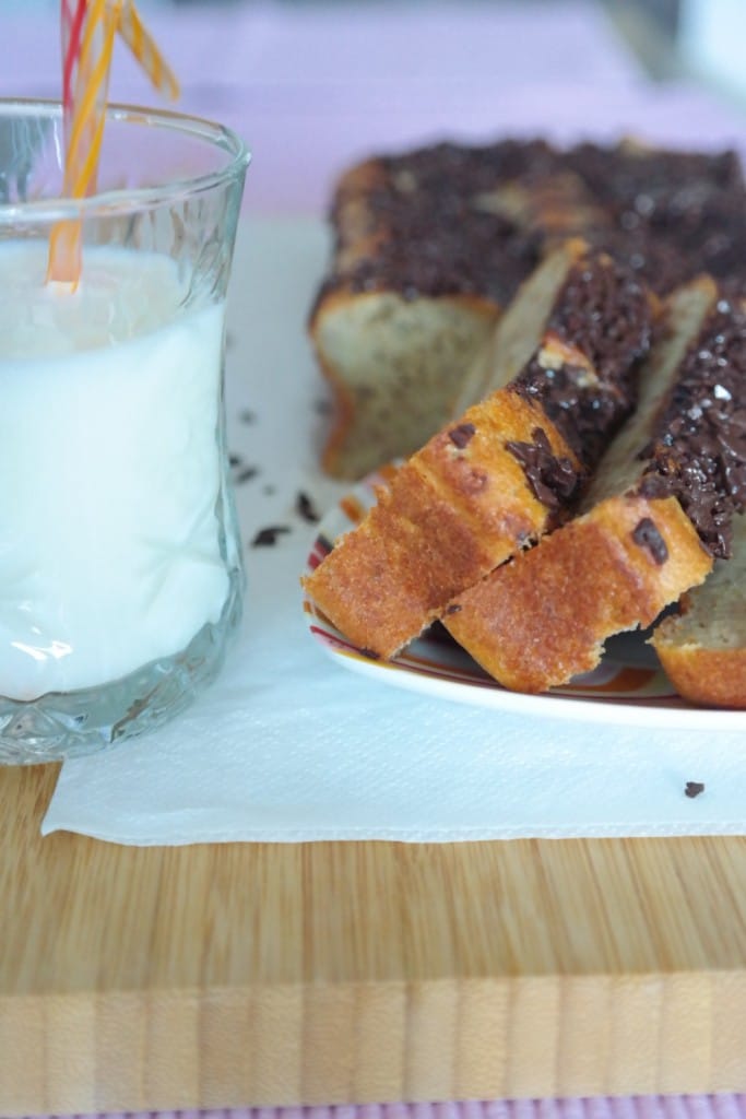 Banana bread with chocolate chips and a cup of milk