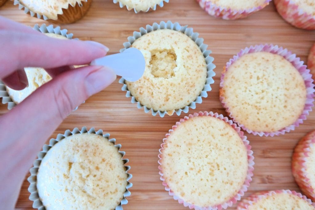 Cupcake with the center removed to make room for caramel filling