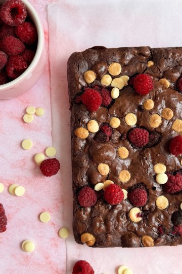Freshly baked white chocolate raspberry brownie in a baking pan