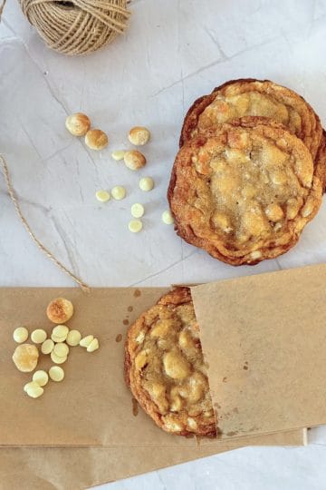 Brown butter macadamia white chocolate cookies served on paper bag