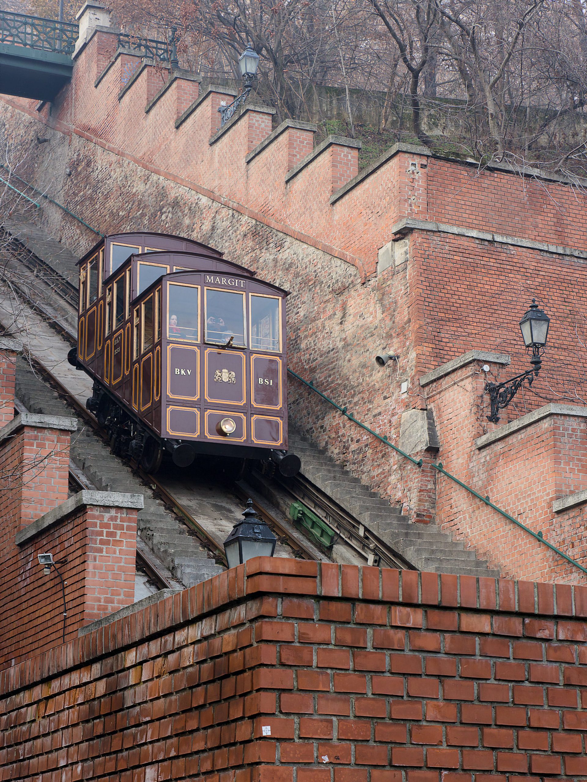 A Buda Castle Funicular carriage on the steep tracks between brick retaining walls